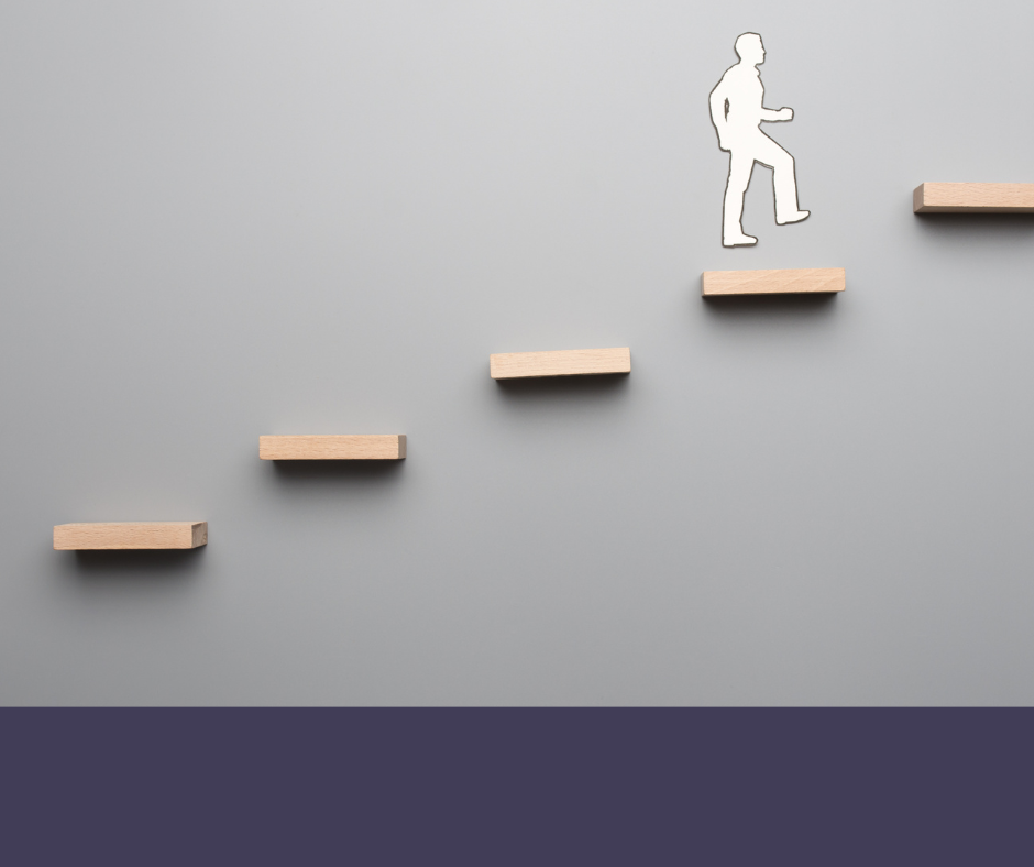 white figure walking up a wall on brown wooden shelves like steps