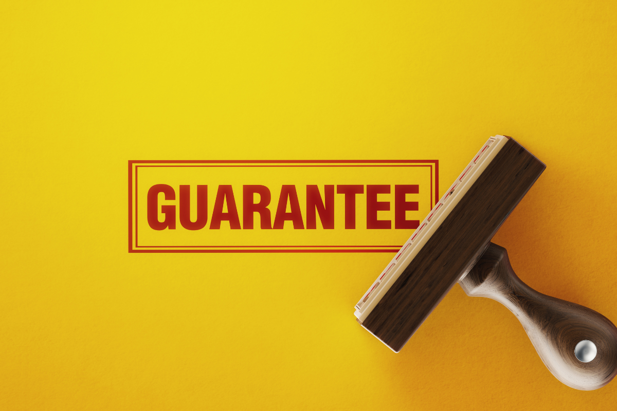 bright yellow graphic with the stamp guarantee across it for first home guarantee scheme in queensland