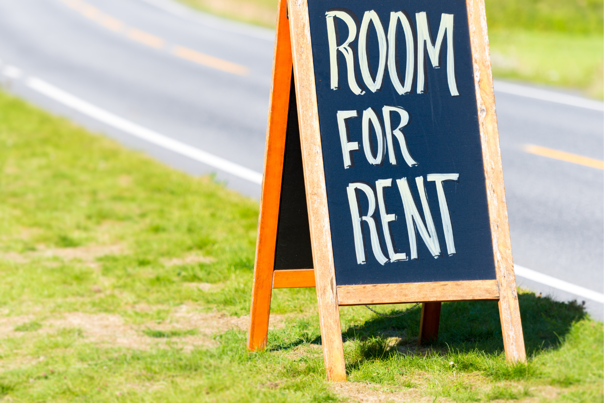 placard with words 'room for rent' sitting by the road on the grass for 'can I rent a room in my home' in QLD