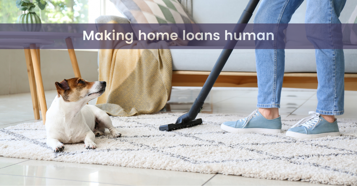 graphic with words the best mortgage broker makes loans human again with an image of someone vacuuming a rug with a cute dog sitting there in their new home