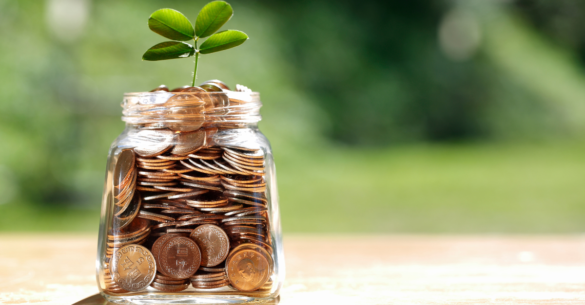 jar or coins with a plant growing out the top for how to use rate cuts to build wealth